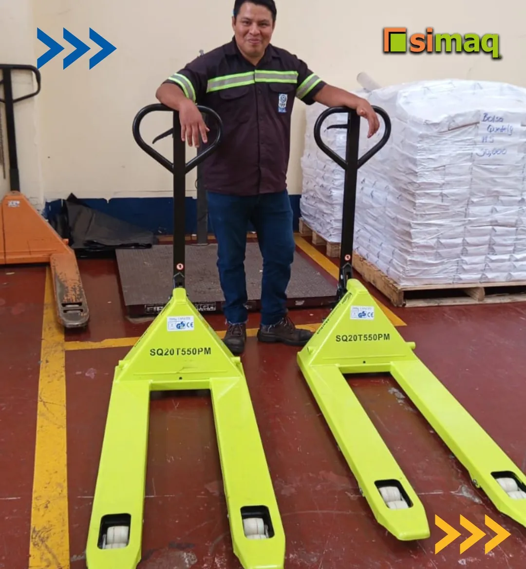 Customer with two newly delivered SIMAQ SQ20T550PM manual pallet jacks in their warehouse